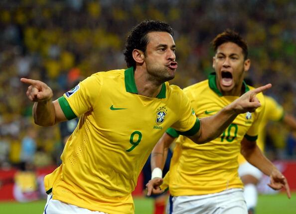 Fred Scores for Brazil against Spain at the Confederations Cup, as Neymar celebrates.